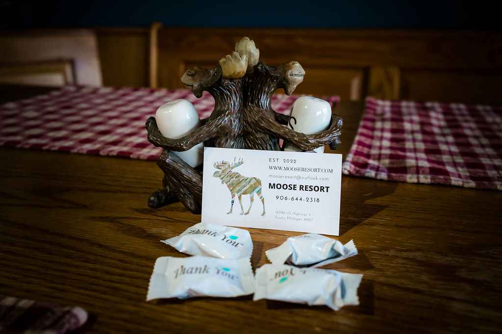 Moose Resort business card with carved moose holder